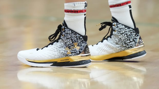Las Vegas Aces guard Kelsey Plum's white and black Under Armour sneakers.